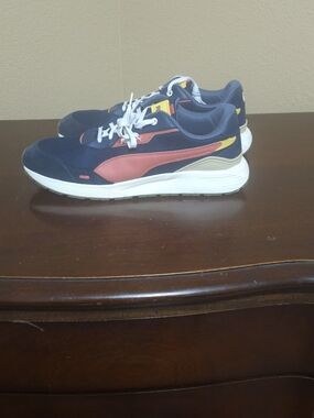 Puma Navy Sneakers with Red and Yellow Accents
